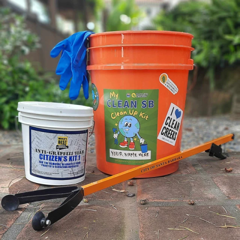 Cleanup Supplies, orange bucket, picker and graffiti removal kit.