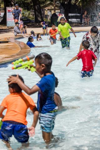 Children play in the water at Oak Park Wading Pool