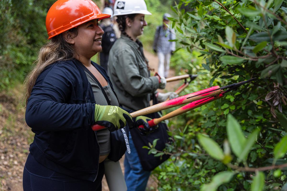 Trail volunteers trim back vegetation