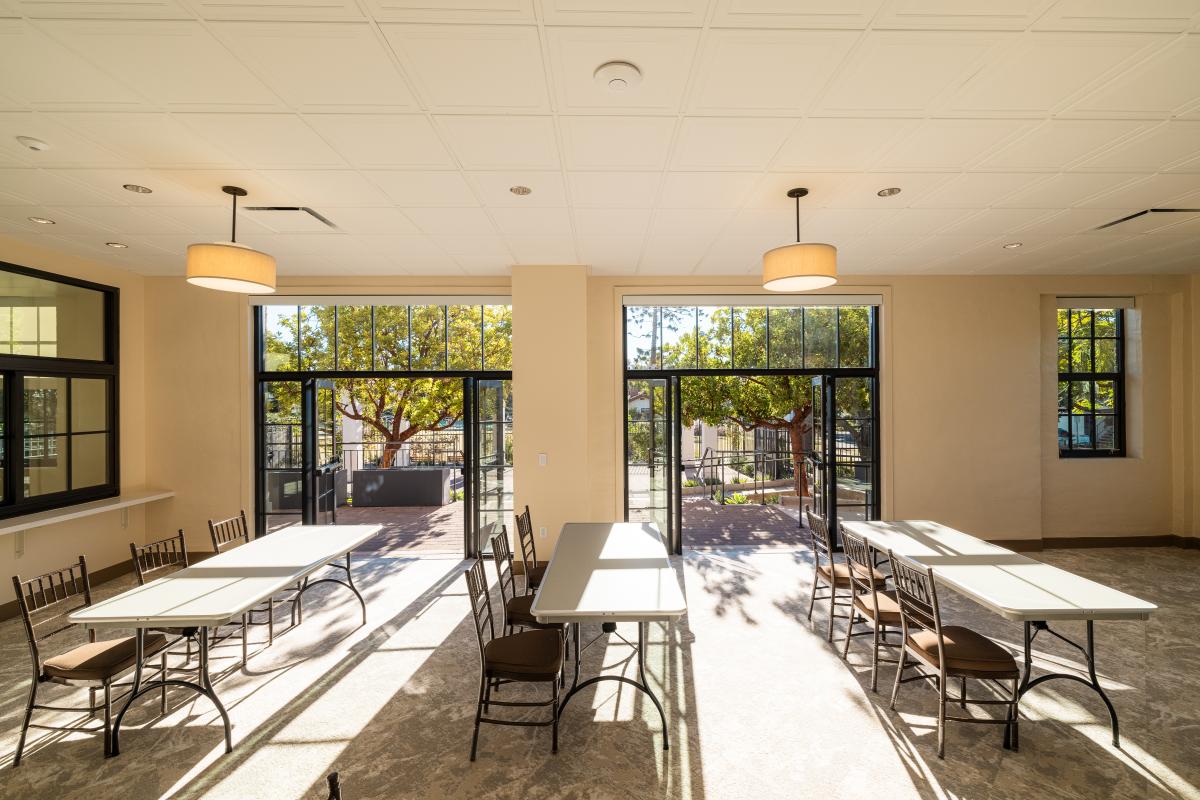 Activity Lounge in the Louise Lowry Davis Center with sunlight shining in through the French doors.